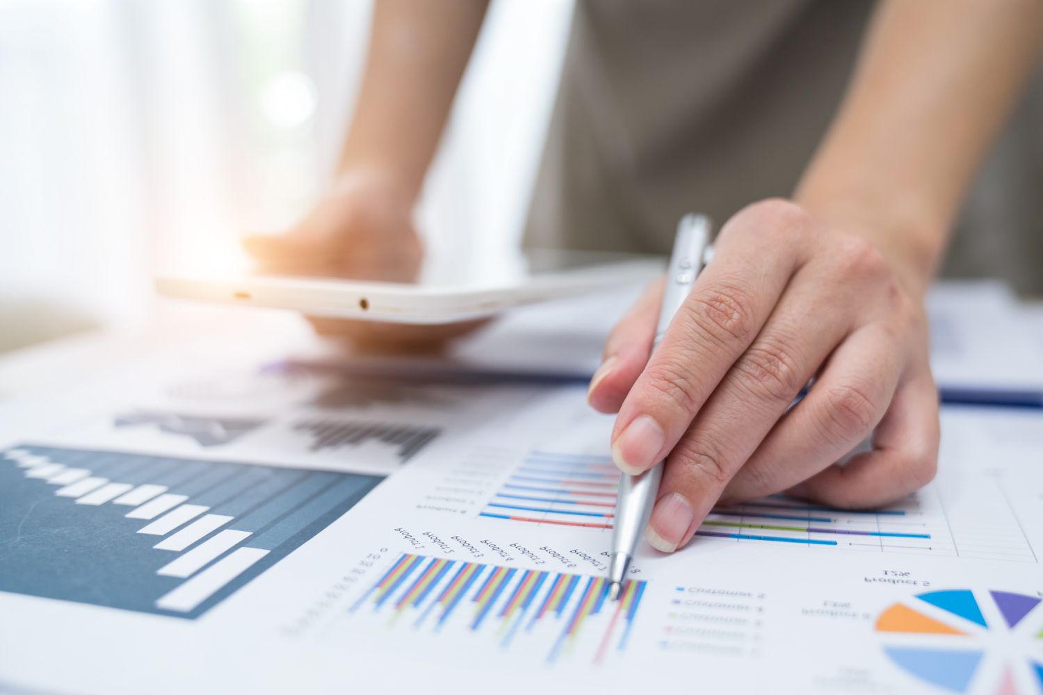 Financial reports and charts being reviewed